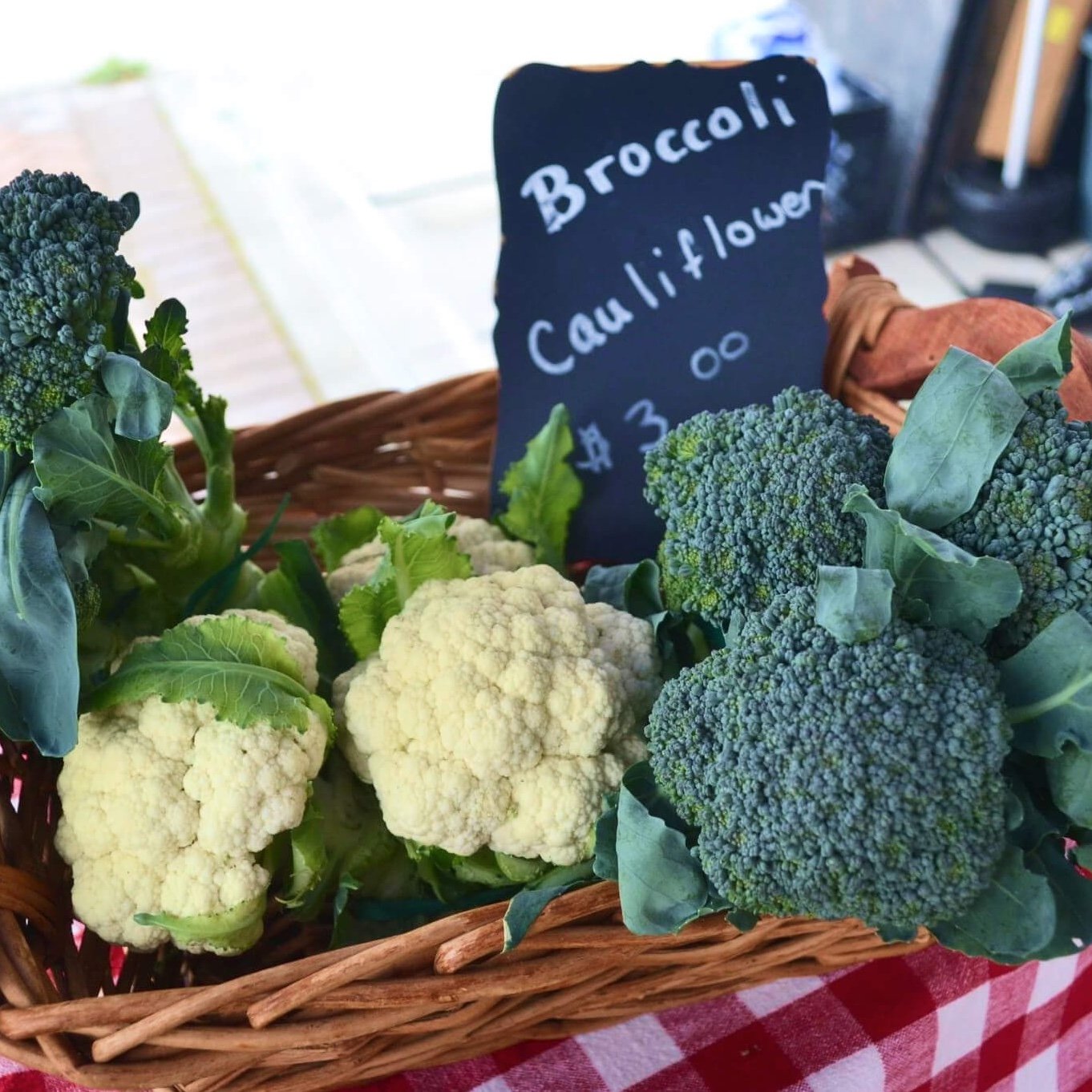 Broccoli and cauliflower in a basket at the market